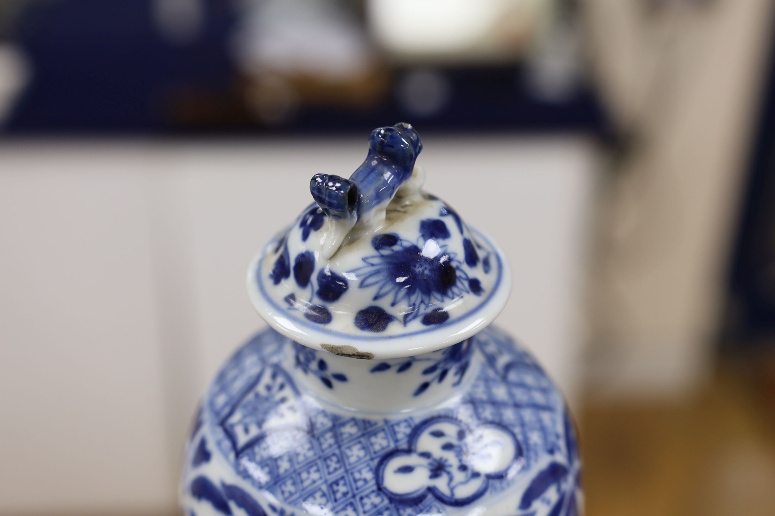 A pair of Chinese blue and white dragon vases and covers, circa 1900. 28cm